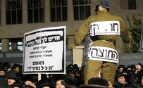 'Haredi soldier' effigy with dog's face at protest