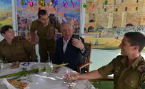 Netanyahu hosts IDF lone soldiers in his sukkah