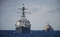 US vessel fires warning shots at Iranian boats