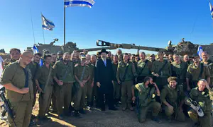 Chief Rabbi visits front line, dedicates artillery shell
