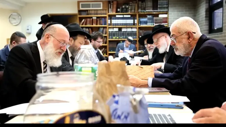 Rabbi Mordechai Willig, left, executes the 2015 sale of hametz to John J. Brown,