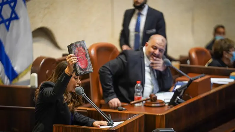 MK Golan holds Chumash in the Knesset