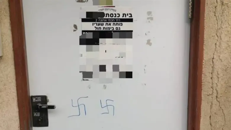Swastikas on the door of the synagogue