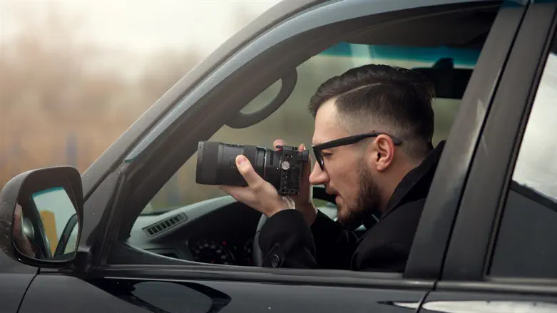 Man spying from his car (illustration)
