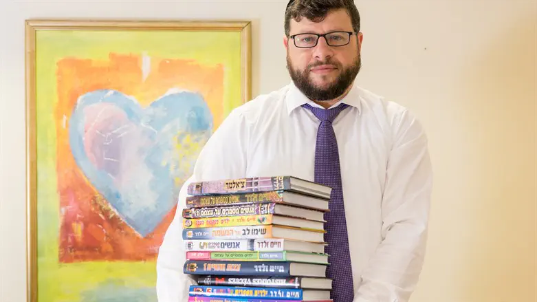 Chaim Walder with some of his books