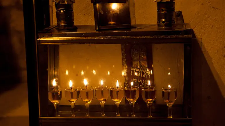 A Hanukkah menorah in Israel glows with the light of olive oil, not candles.