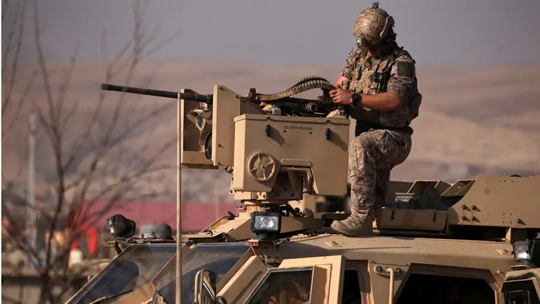 American soldier on armored vehicle in Iraq