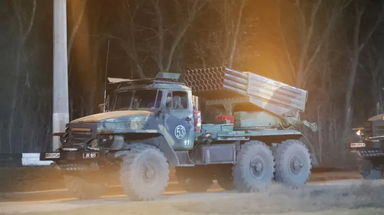 A military vehicle on a street on the outskirts of the city of Donetsk, Ukraine
