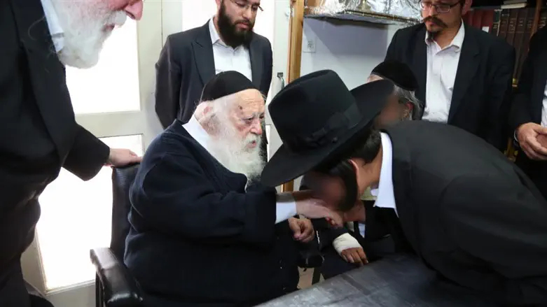 Rabbi Kanievsky blesses a bar mitzvah boy whose mother was rescued by Yad L’Achim