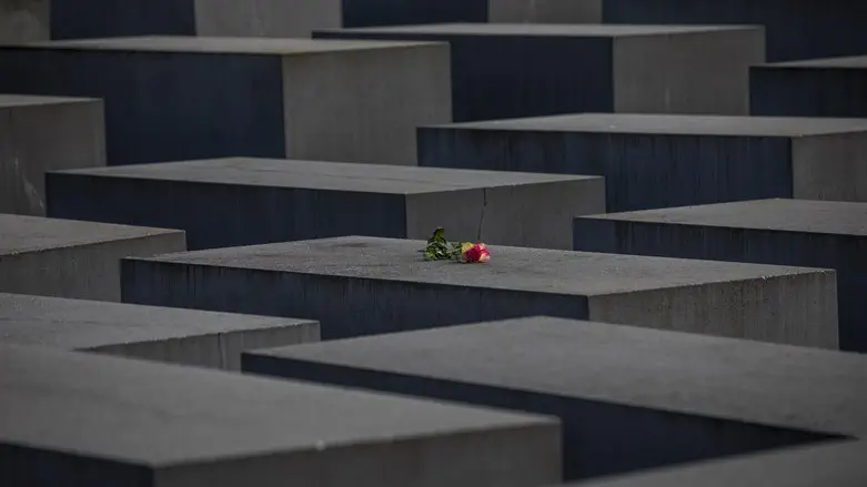 A rose is placed on the Holocaust Memorial on the International Holocaust Rememb