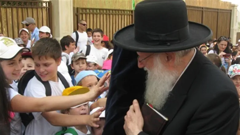 Children kiss Torah scroll they helped write