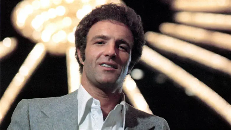 James Caan stands under casino lights in a scene from the 1974 film "The Gambler