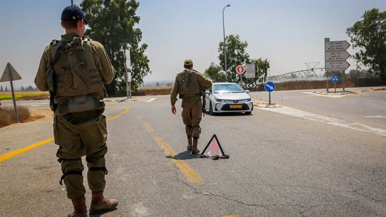 Israeli soldiers block roads near the border with the Gaza Strip
