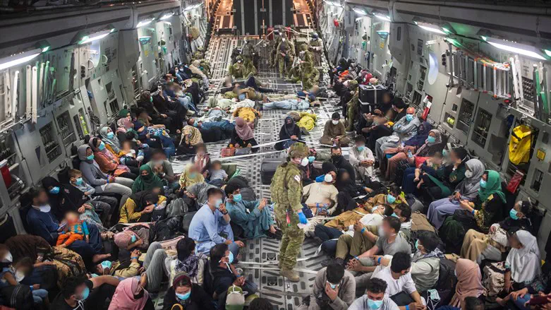 Australian citizens & visa holders on a RAAF plane, after evacuating from Afghanistan