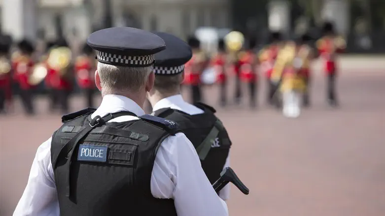 Heavily armed police officers on Guard near Buckingham Palace, London