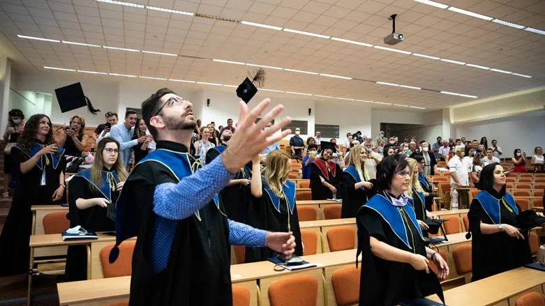 Students & faculty attend a graduation ceremony at Milton Friedman University in Budapest