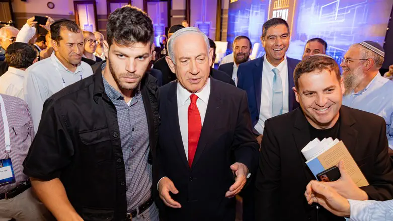 Benyamin Netanyahu while leaving the conference 