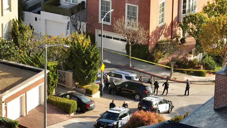 San Francisco police officers and F.B.I. agents gather in front of Pelosi's home