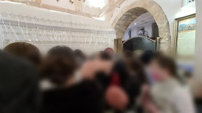 Some of the survivors in prayer at Rachel's Tomb