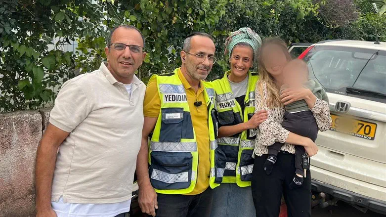 The volunteers with the rescued child