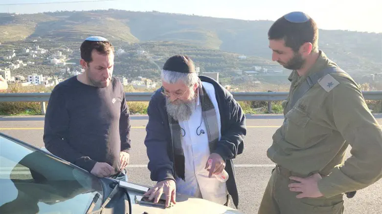 Yossi Dagan with driver who was shot at