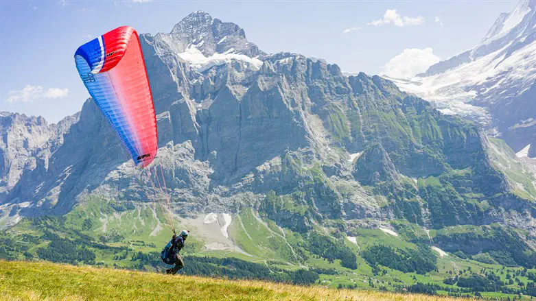 Paragliding in the Swiss Alps. Archive