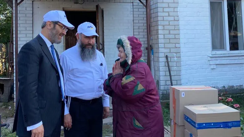 Rabbis Raphael Rotman and Meir Stambler deliver boxes in Bucha, Ukraine