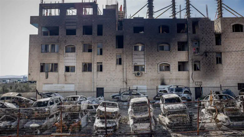 Torched cars and building in Huwara, February 27th, 2023