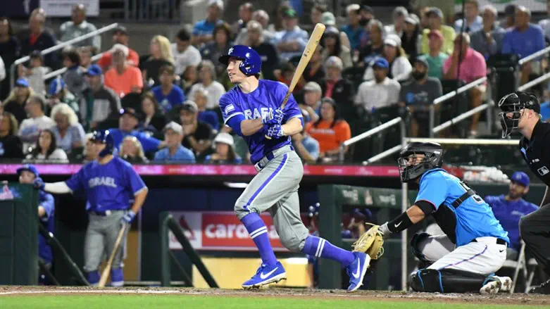 Ty Kelly bats during Israel's exhibition game against the Miami Marlins