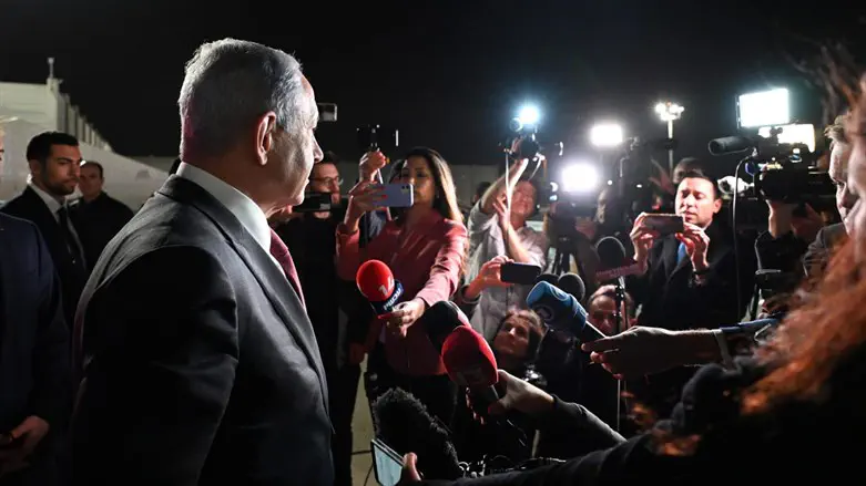 Netanyahu speaks with reporters before departing for Berlin