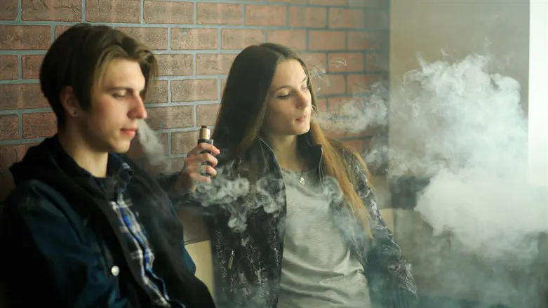 Teens teenagers vaping smoking electronic cigarettes