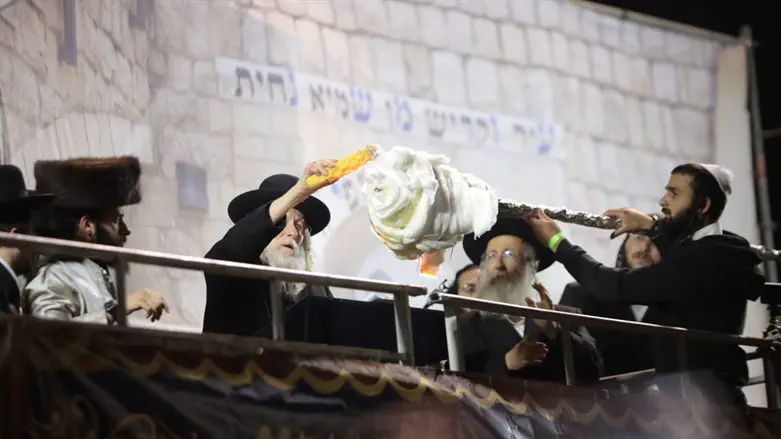 Eliezer Berland lighting the bonfire torch in Meron