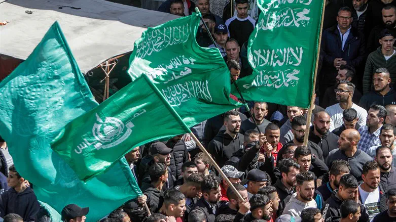 Arabs wave Hamas flags