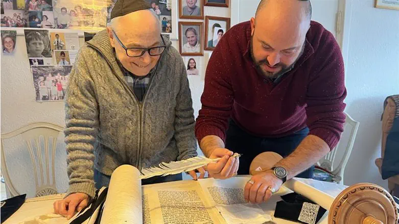 Holocaust survivors are helping to rewrite the Torah scroll, letter by letter