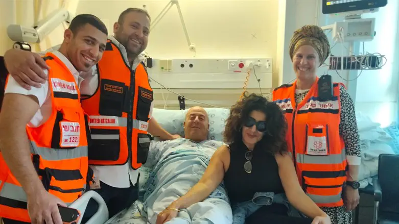 (L-R) EMTs Asher Elmasi and David Sfedj, with Yosef and Chedva Cohen, and EMT Joelle Cohen