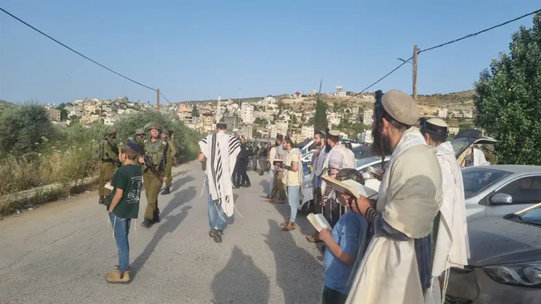 The prayers outside the Arab village