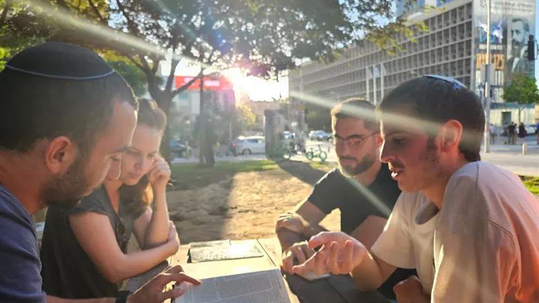 Religious and secular Israelis study Torah together in Tel Aviv