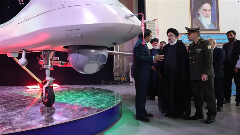 The president of Iran next to the new UAV 