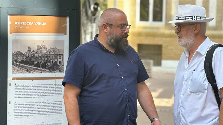 Ladislav Trajer (L) and Mirko Štark chat just outside the entrance to their synagogue.