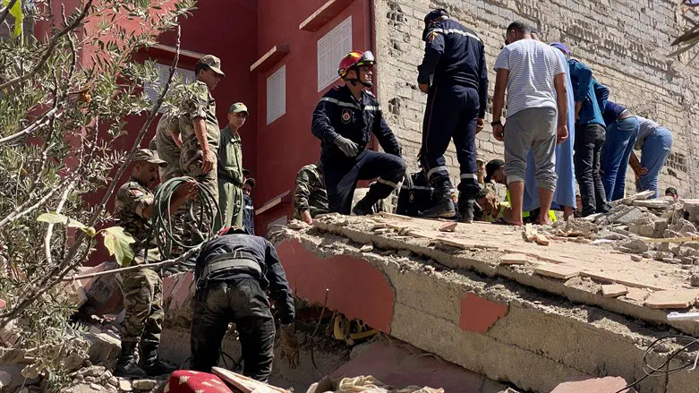 Rescuers carry a search operation following a powerful earthquake, in Amizmiz, i