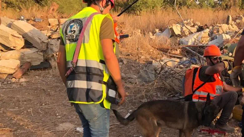 Israel Dog Unit volunteer simulates directing rescue forces