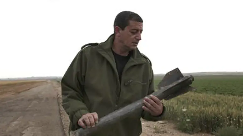 Sderot officer examines spent rocket