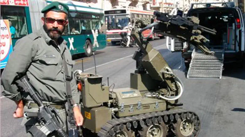 Israel Border Guard sapper and robot
