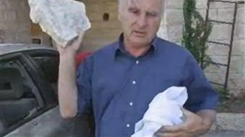 Meir Indor, with a rock thrown at him