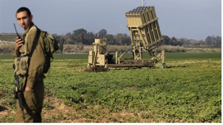IDF soldier stands near part of Iron Dome sys
