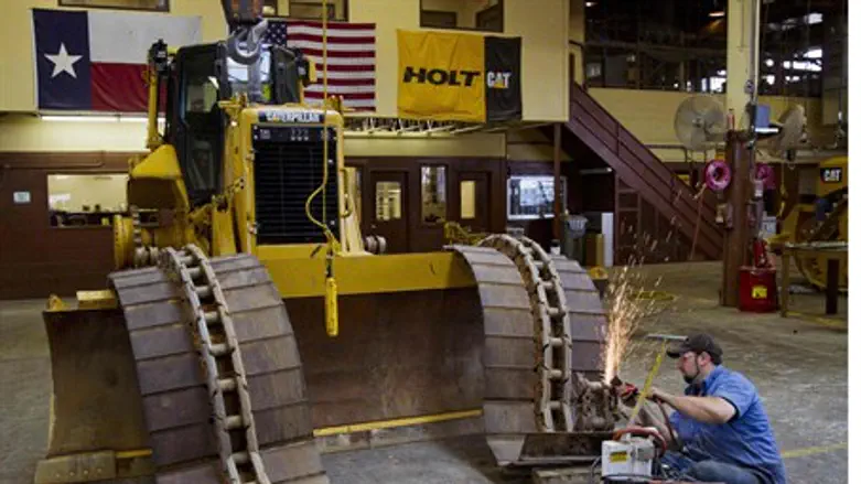 Working on track of Caterpillar bulldozer in
