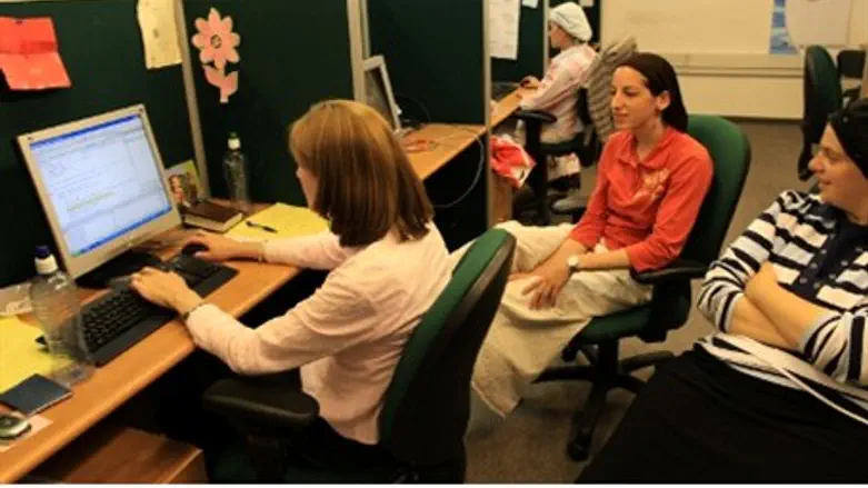 Ultra orthodox women work on their computers