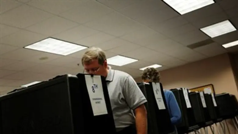  Voters cast ballots on touch-screen voting m