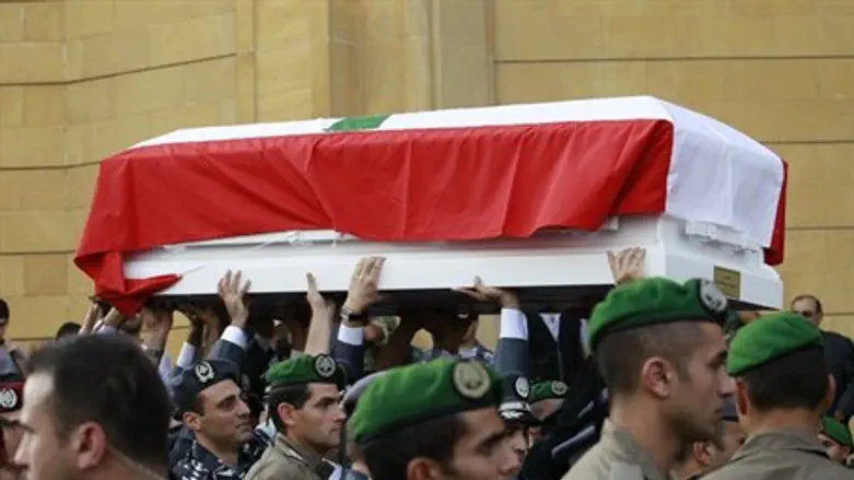 The coffins of Wissam al-Hassan and his bodyg