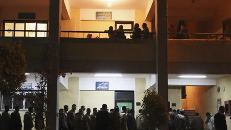 People queue outside a polling station the fi